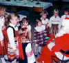 Estonian supplementary school children getting acquainted with Santa Claus (Jõuluvana) in Calgary, Alberta in 1988.