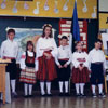Five keen students, dressed in colourful Estonian folk costumes, ready to perform at the School in Calgary, Alberta in 1991.
