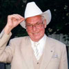 Estonian President Lennart Meri presented with a white Stetson hat upon his arrival in Calgary, Alberta in 2000.