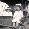 The Ellen Catherine Erdman and Clara Flink are enjoying a ride in a horse drawn carriage, ca. 1915.