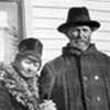 Roughly twenty years after they arrived at Sylvan Lake, Alberta, Emilie and Henry Kingsep are photographed in front of their home in Medicine Valley area of Alberta.