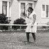 Early 1930s: Charlotte and Ellen playing tennis in the Erdman yard.