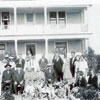 The Gus Erdman farm house was built about 1918; this gathering took place in 1930. Gus is in the middle with white shirt and suspenders. Jakob and Mari Erdman, seated on the left, are the parents of Gus Erdman.