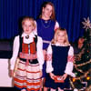Three young Calgarians show off their colorful Estonian folk costumes during a Christmas Celebration in 1988. L to R: Erika Kivik, Krista Leesment and Milvi Tiislar.